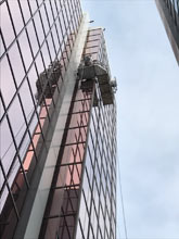 Corner swing stage set up for window replacement downtown St John's NL. 